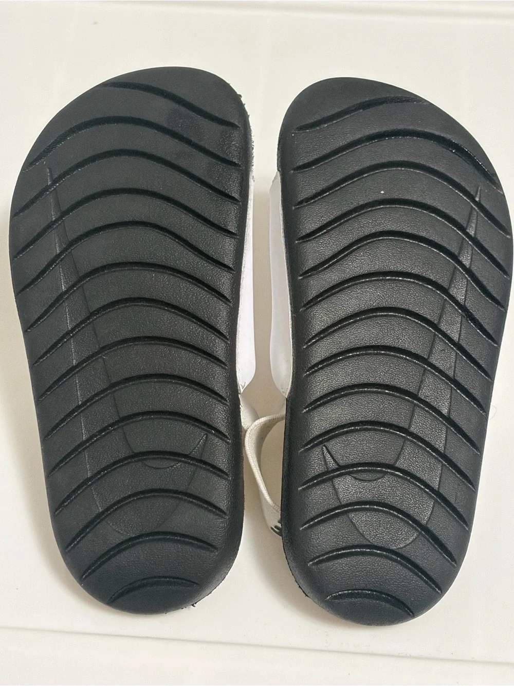Nike White Strap Black Footbed Kids Slides with Swoosh